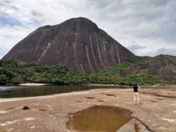 Deidre birding at the Mavecure hills Birder on front of the mavecure hills